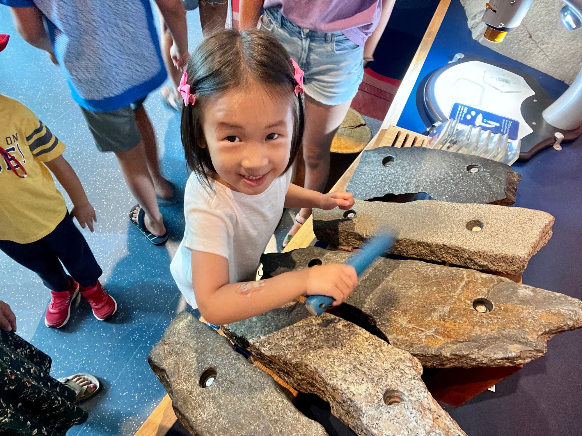 Playing prehistoric rock xylophone at Science World