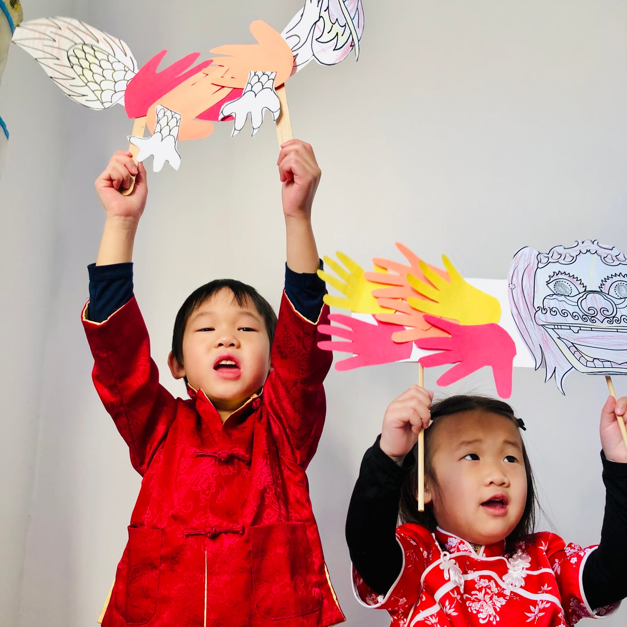 Dragon and lion handprint craft for Chinese New Year